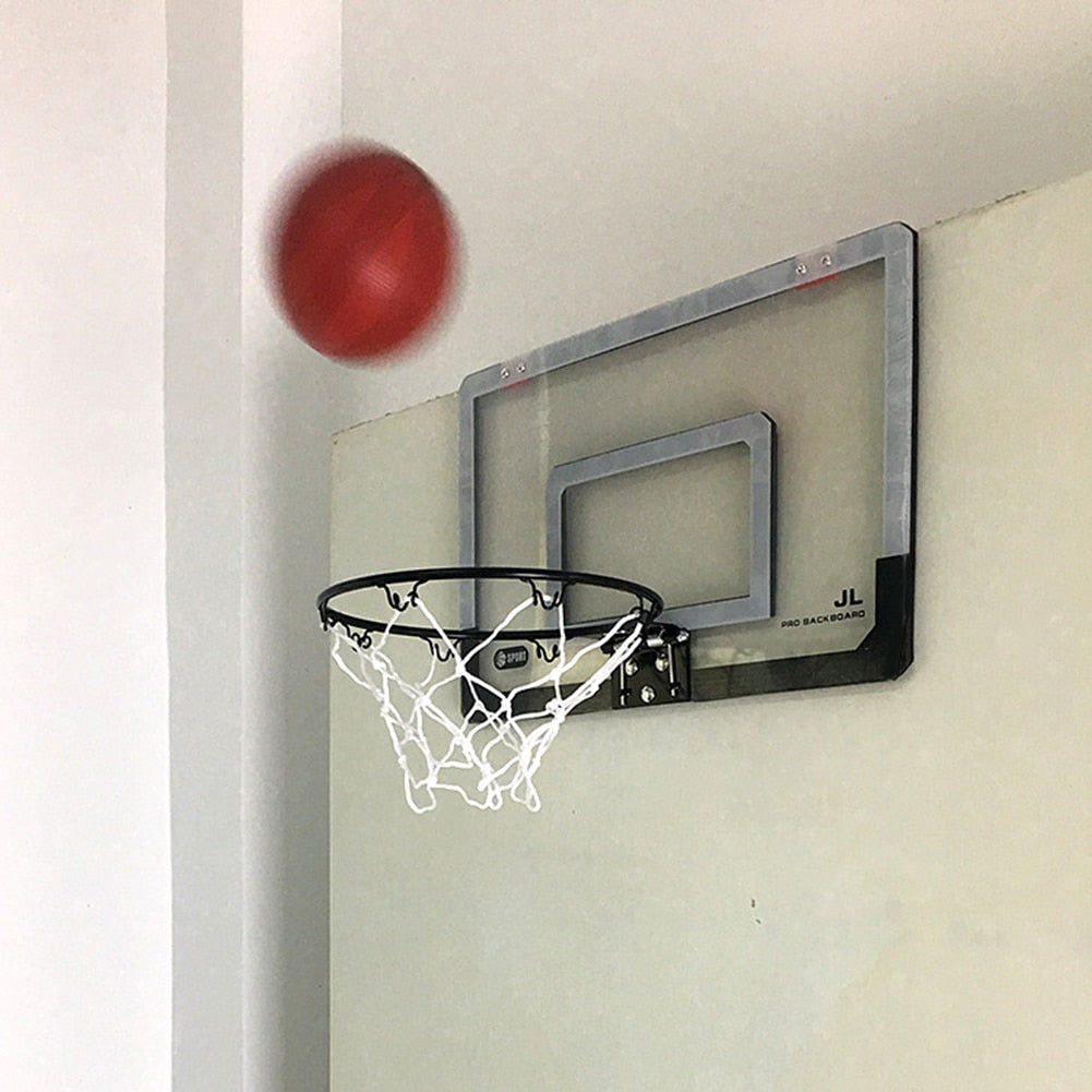 Child Hanging Basketball Hoop